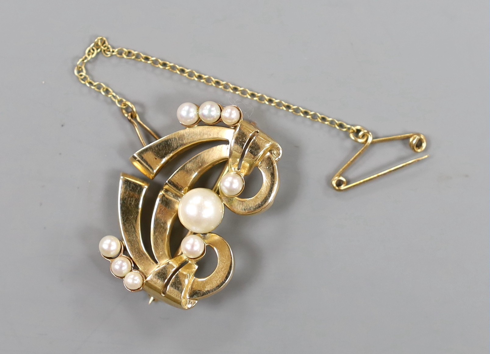 A 14k yellow metal and cultured pearl cluster set geometric brooch , width 30mm, gross weight 7 grams.